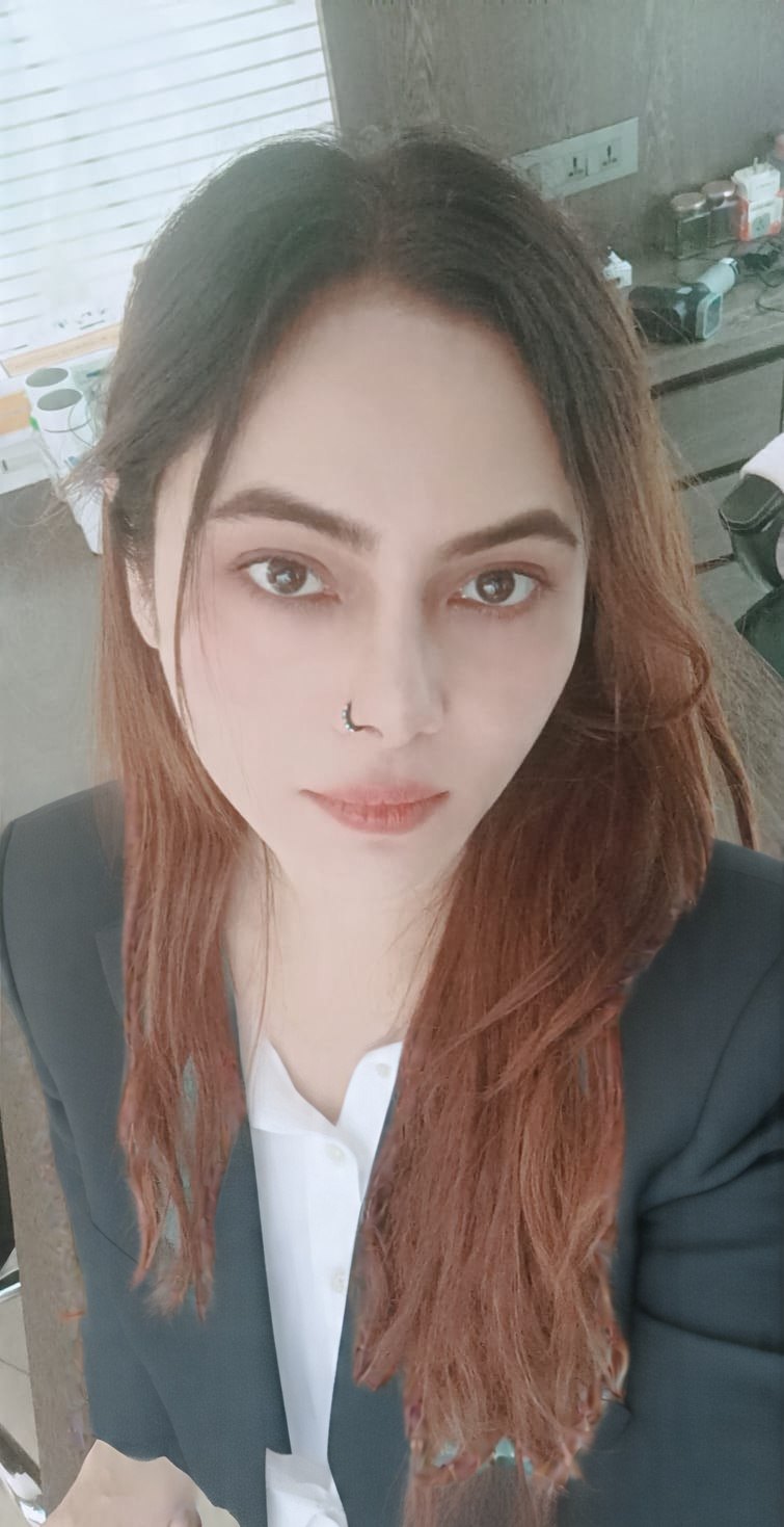 Vibha Jain, hypnotherapy practitioner at Hypnotherapy Pvt Ltd, in professional dress at her practice